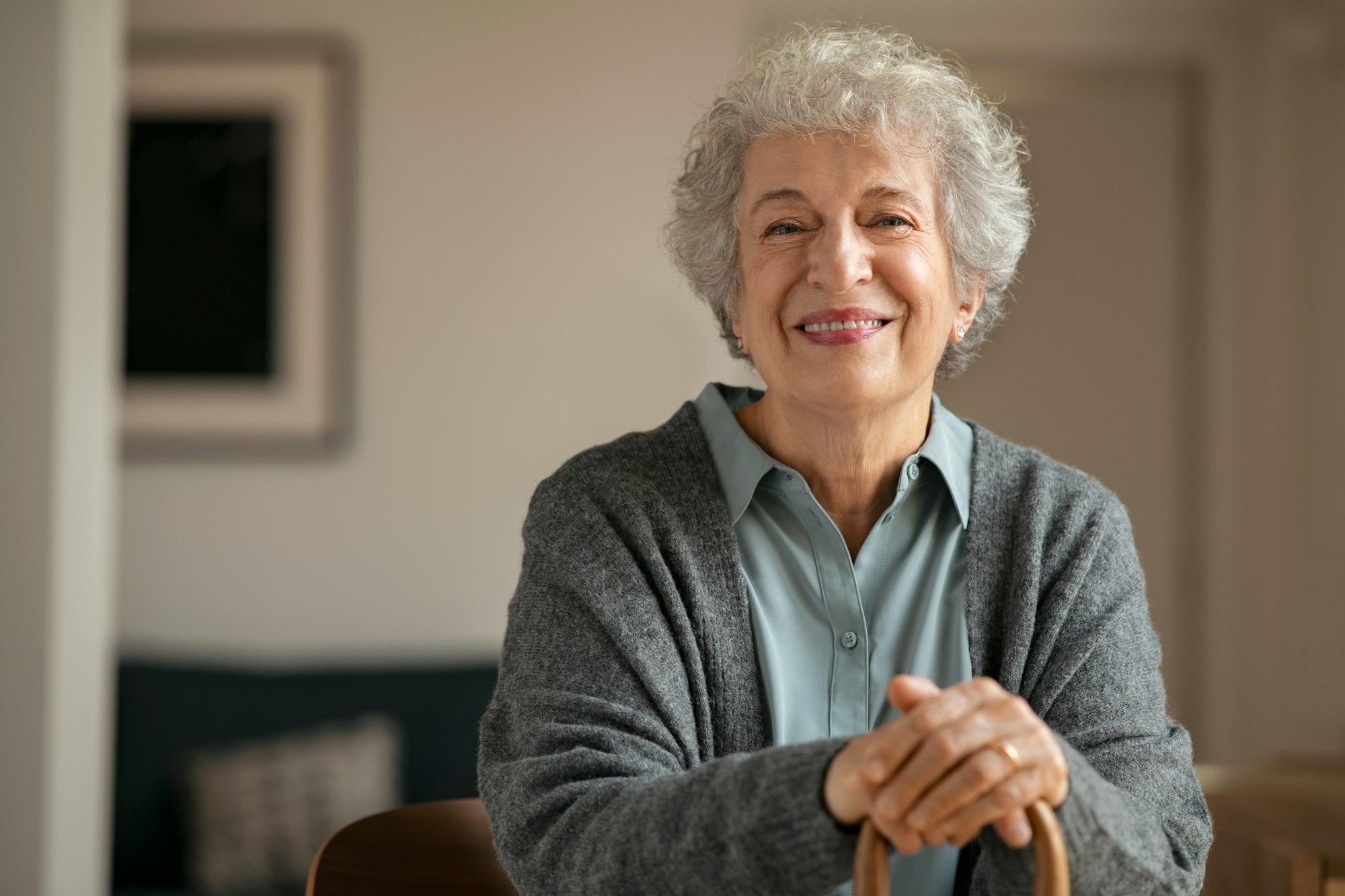 Old happy grandmother looking at camera