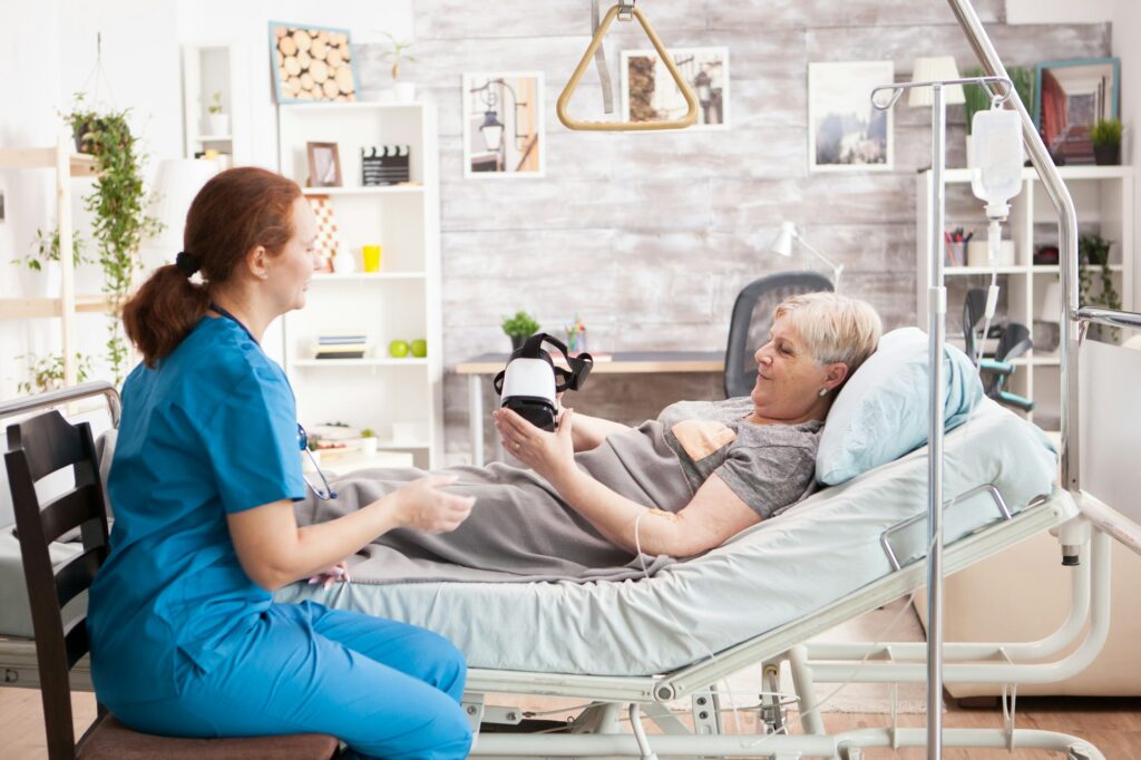 Old woman laying on bed in nursing home